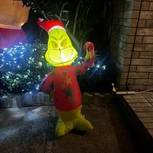 Festive Inflatable Grinch with Santa Hat